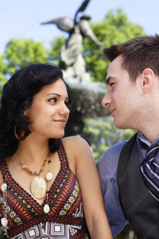 Fototapeta premium Young couple gazing into each other's eyes.