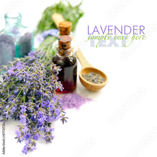 Lavender fresh flowers and lavender oil on white background