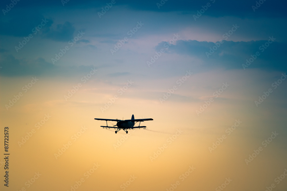 aircraft flying in the sky spraying mosquitoes