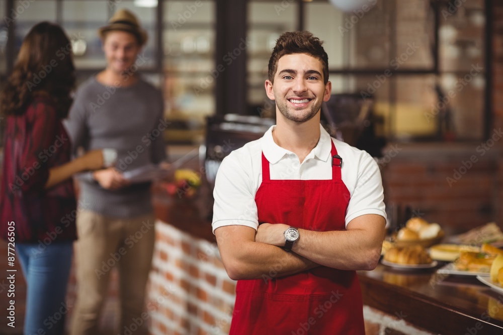 Fototapeta premium Handsome waiter with arms crossed