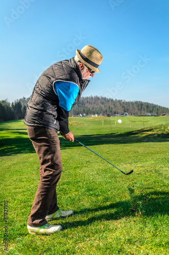 Senior citizen is playing golf