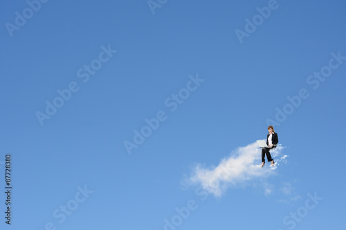 Asian business woman sit on the cloud