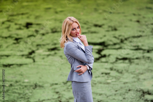 businesswoman thinks against the swamp