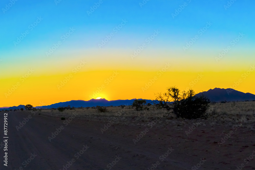 Sunset in Namibian desert.