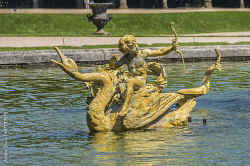 Dragon fountain in gardens of Versailles palace. Paris  France.