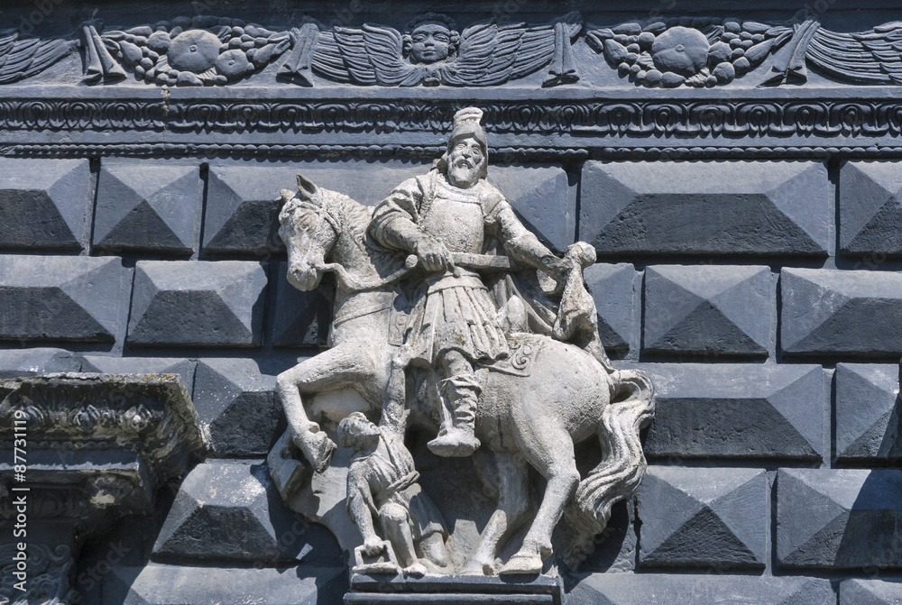 Obraz premium Rider sculpture on street wall in Lviv
