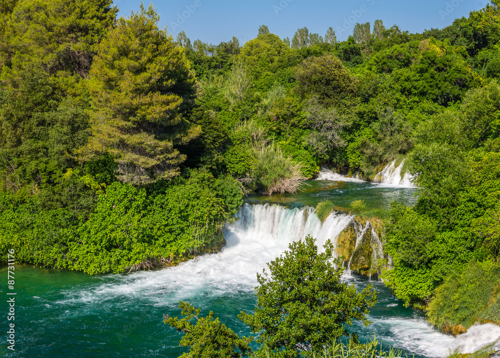 Fototapeta premium Krka waterfalls in the forest on a sunny day.