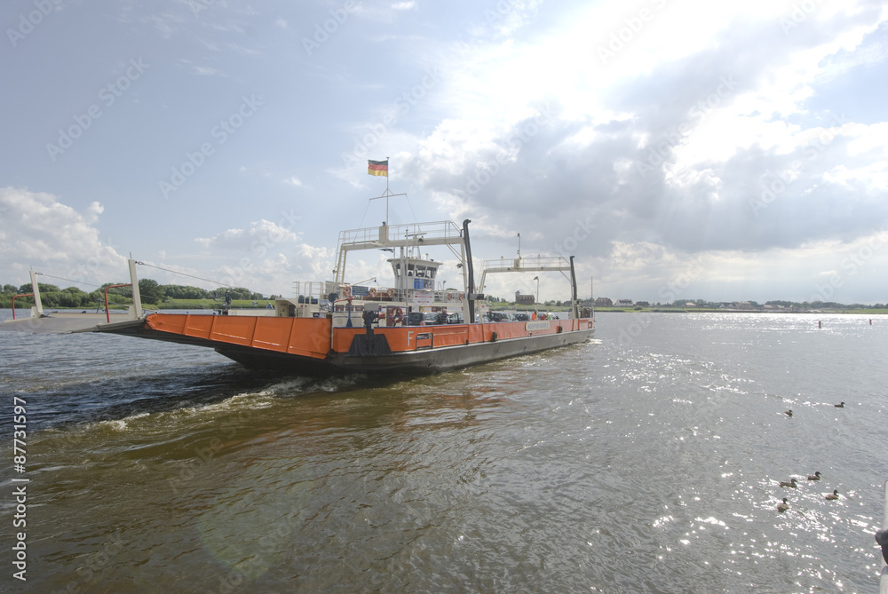 The Elbe ferry Zollenspieker goes with cars, motorcycles, bicycles in the direction of the other Elbe shore.