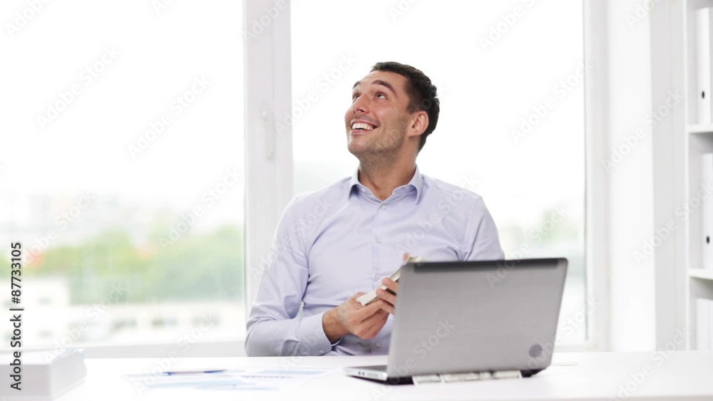 happy businessman with money and laptop in office happy businessman with money and laptop in office