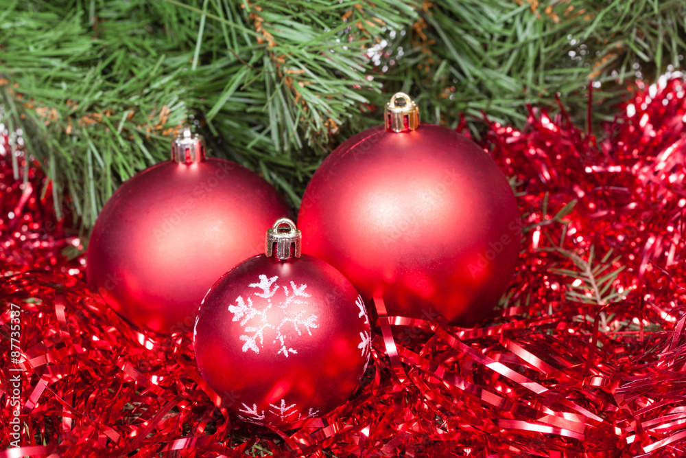 few red Christmas balls, tinsel and Xmas tree few red Christmas balls, tinsel and Xmas tree