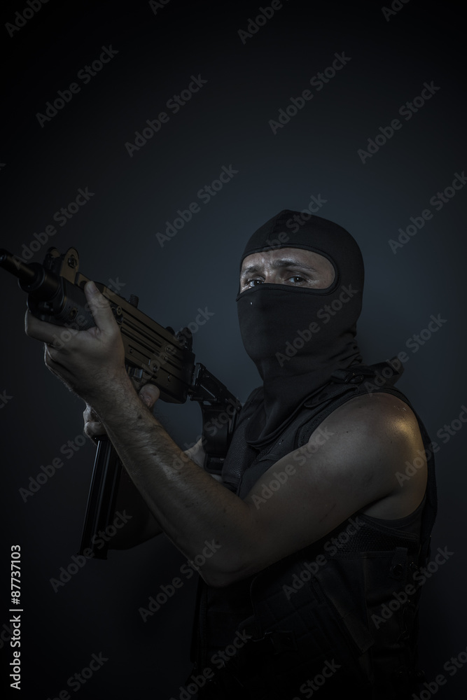 Man wearing balaclavas and bulletproof vest with firearms Man wearing balaclavas and bulletproof vest with firearms
