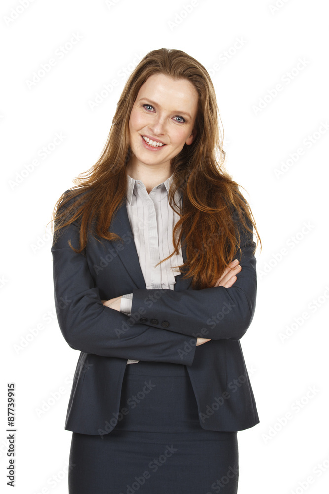 An attractive businesswoman wearing a jacket smiles at the viewer with her arms crossed. An attractive businesswoman wearing a jacket smiles at the viewer with her arms crossed.