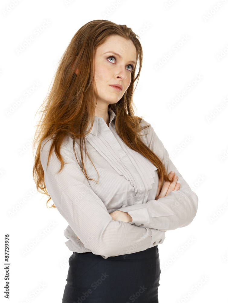 An attractive young woman with her arms folded and looking away. An attractive young woman with her arms folded and looking away.