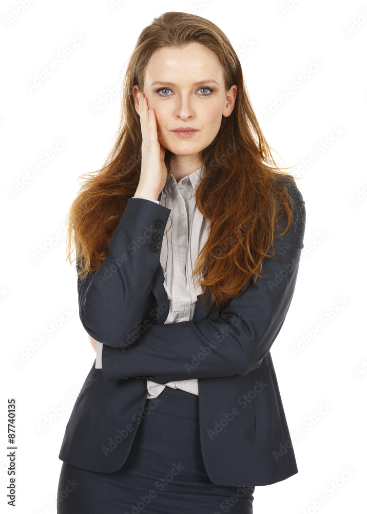 An attractive businesswoman wearing a jacket looks at the viewer with her hand to her face. An attractive businesswoman wearing a jacket looks at the viewer with her hand to her face.