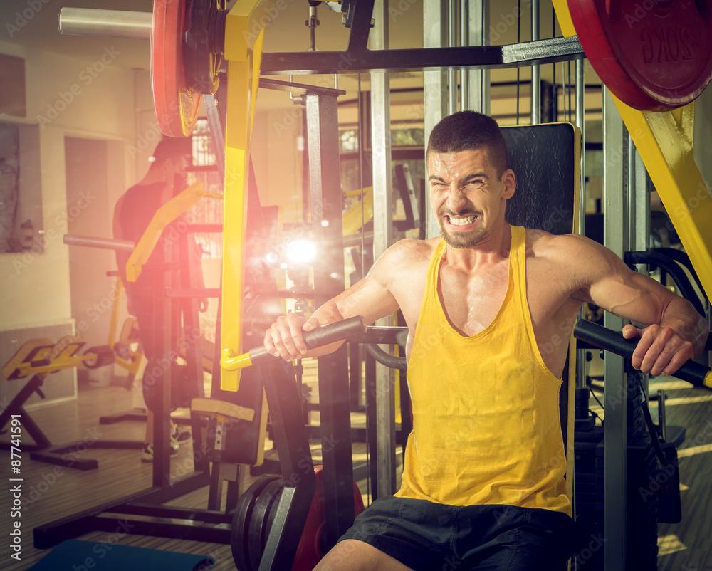 Young Male Doing Chest Exercises in the Gym Stock Image - Image of