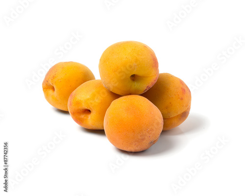 Ripe juicy apricots. Isolated on white background