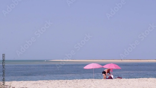 Tourists at Armona cost beach, Algarve, southern Portugal.