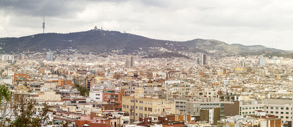 panoarama of barcelona with mountains in summer