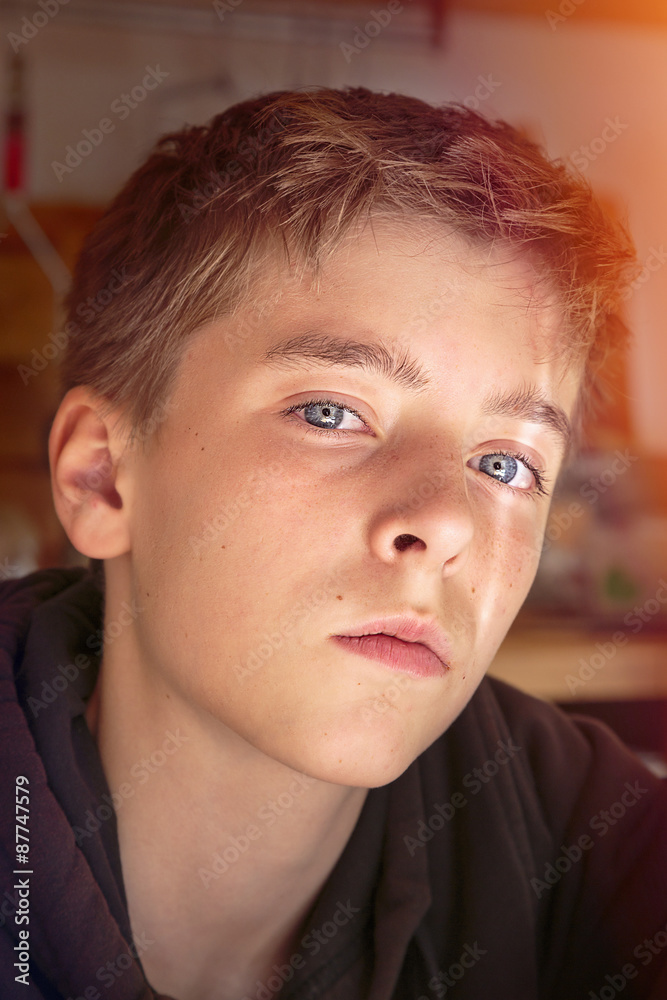 portrait of a teenage boy with light leak portrait of a teenage boy with light leak