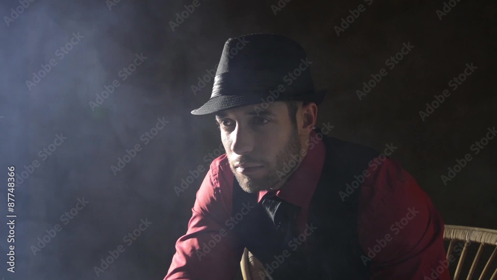 Man in a hat with fog rising around him
Man in a hat with fog rising around him