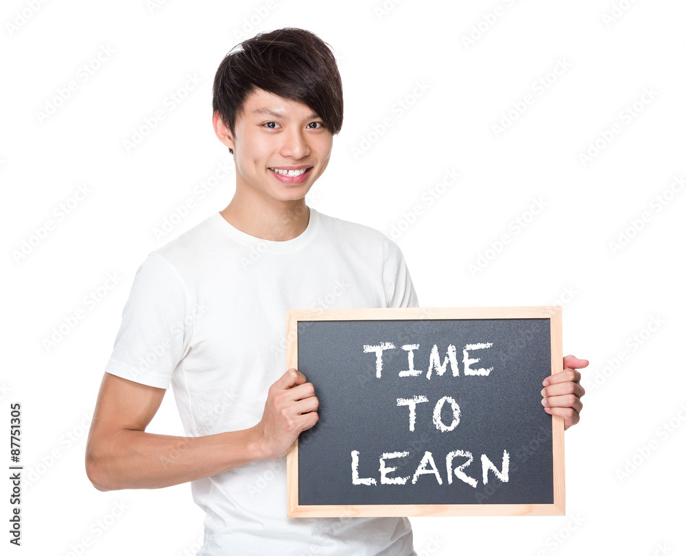 Young university student with blackboard showing phrase of time Young university student with blackboard showing phrase of time