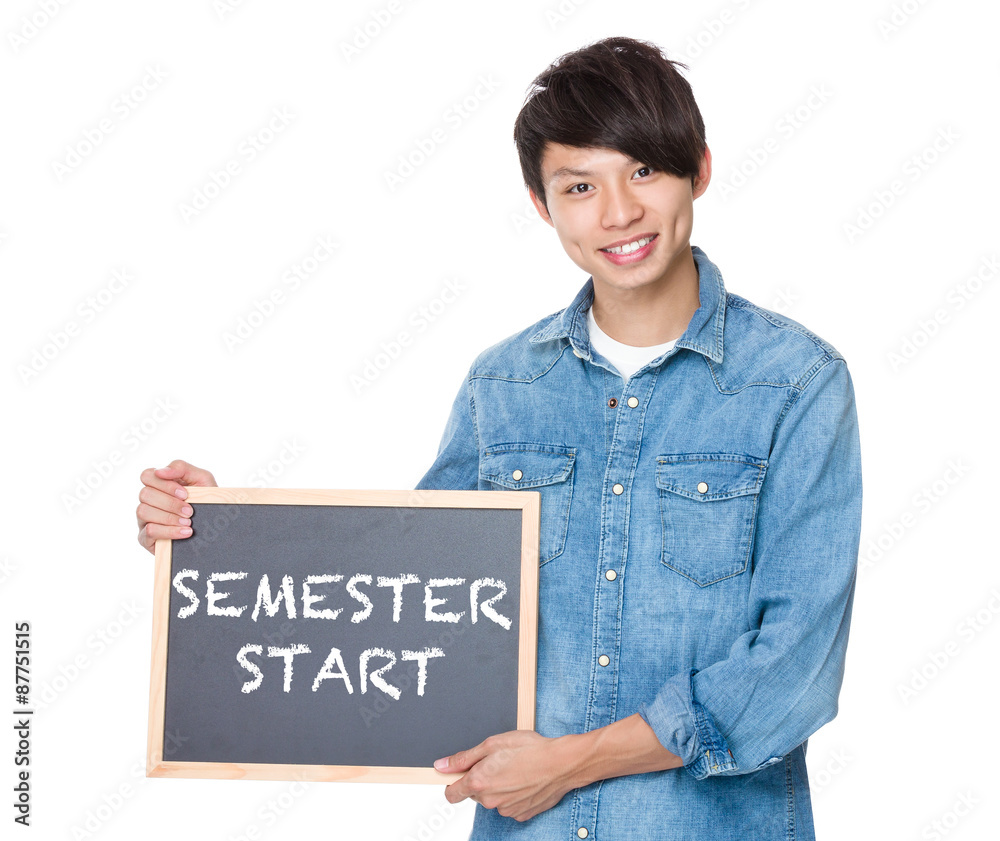 Man hold with blackboard showing phrase of semester start Man hold with blackboard showing phrase of semester start