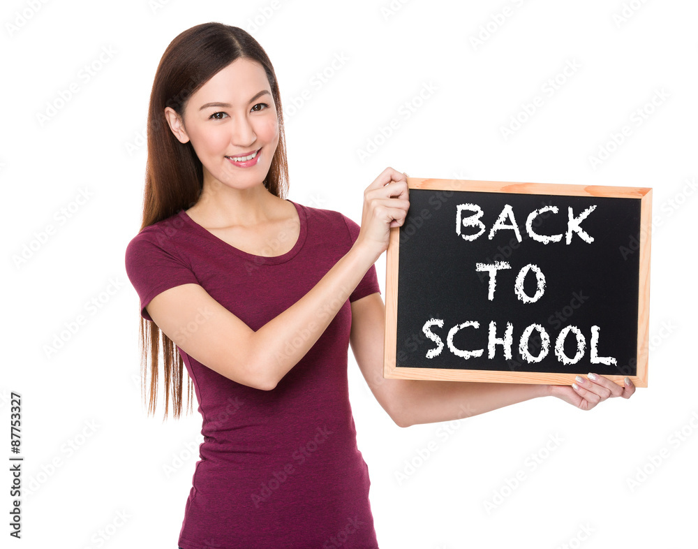 Asian woman with chalkboard showing phrase of back to school Asian woman with chalkboard showing phrase of back to school