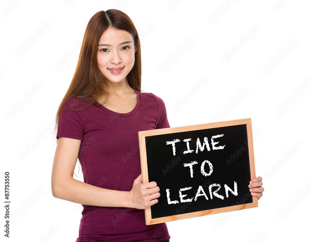 Young student hold with chalkboard showing phrase time to learn Young student hold with chalkboard showing phrase time to learn