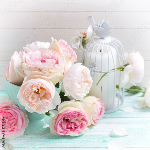 Background with sweet pink roses in vase and candle © daffodilred