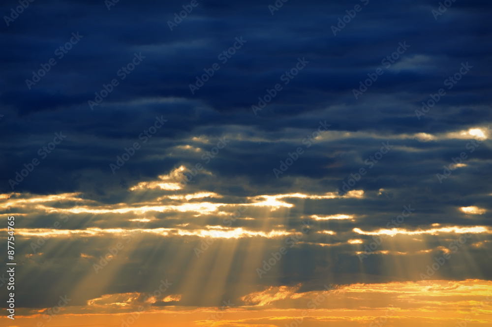 Rays of light shining through dark clouds for background Rays of light shining through dark clouds for background