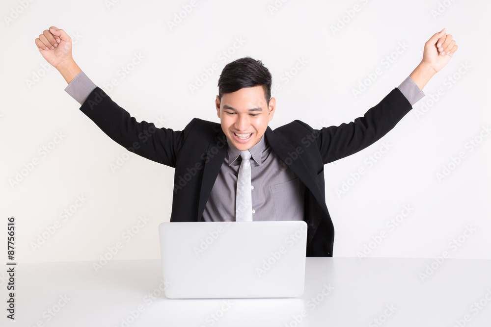 Successful online business man with laptop. isolated over a whit Successful online business man with laptop. isolated over a whit