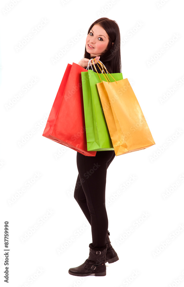 young woman with shopping bags isolated on white young woman with shopping bags isolated on white