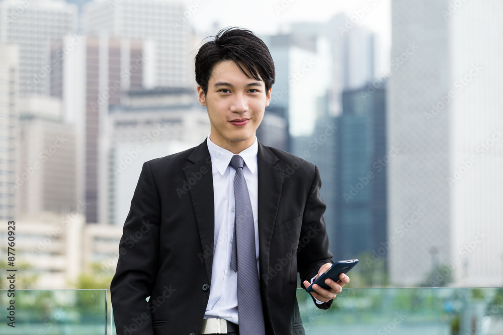 Businessman use of cellphone in Hong Kong Businessman use of cellphone in Hong Kong