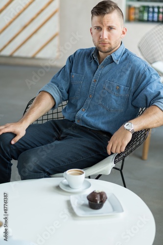Young man in cafe photo