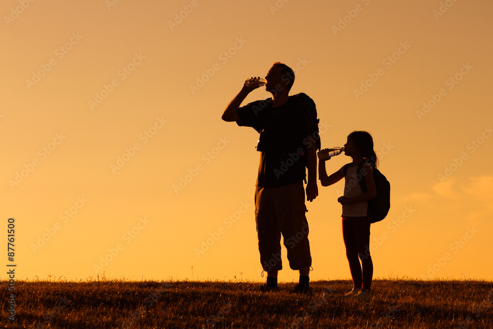 Refreshment for father and daughter hikers