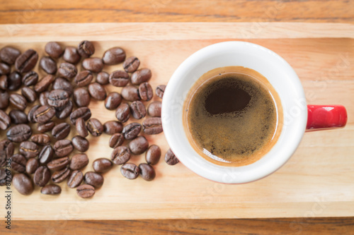 Fresh brewed hot espresso with roasted bean