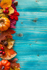 Autumn background with colorful leaves and pumpkins