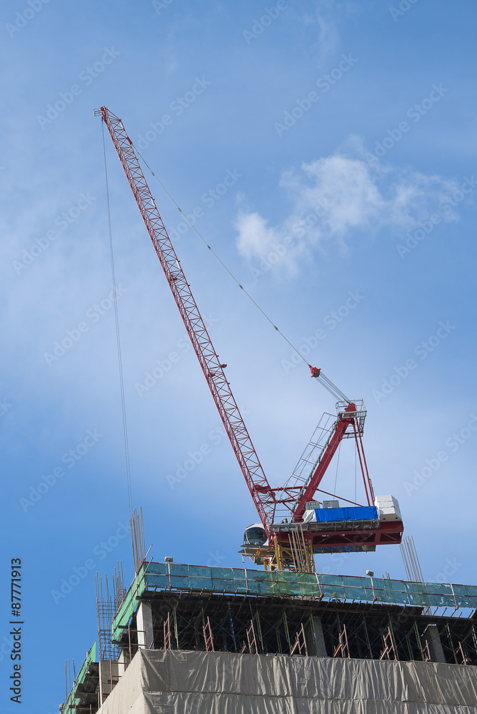 Construction site with cranes on sky background Construction site with cranes on sky background