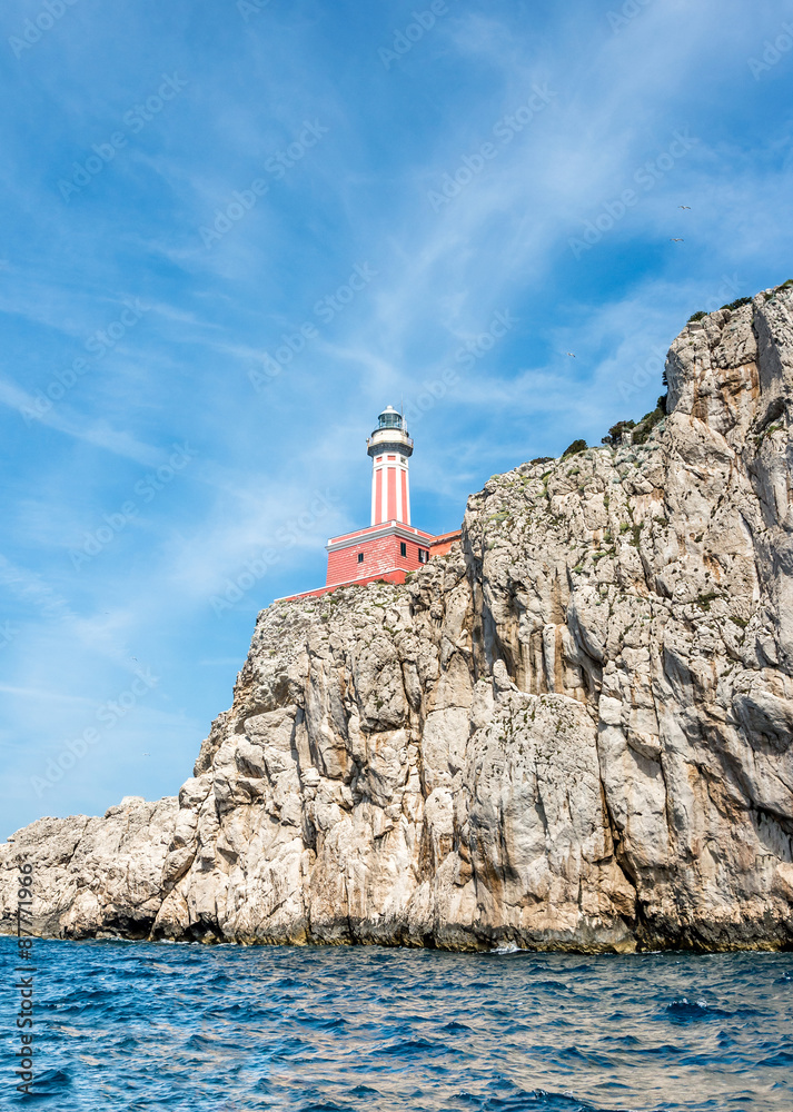 Red lighthouse on the rock of isle of Capri, Italy.