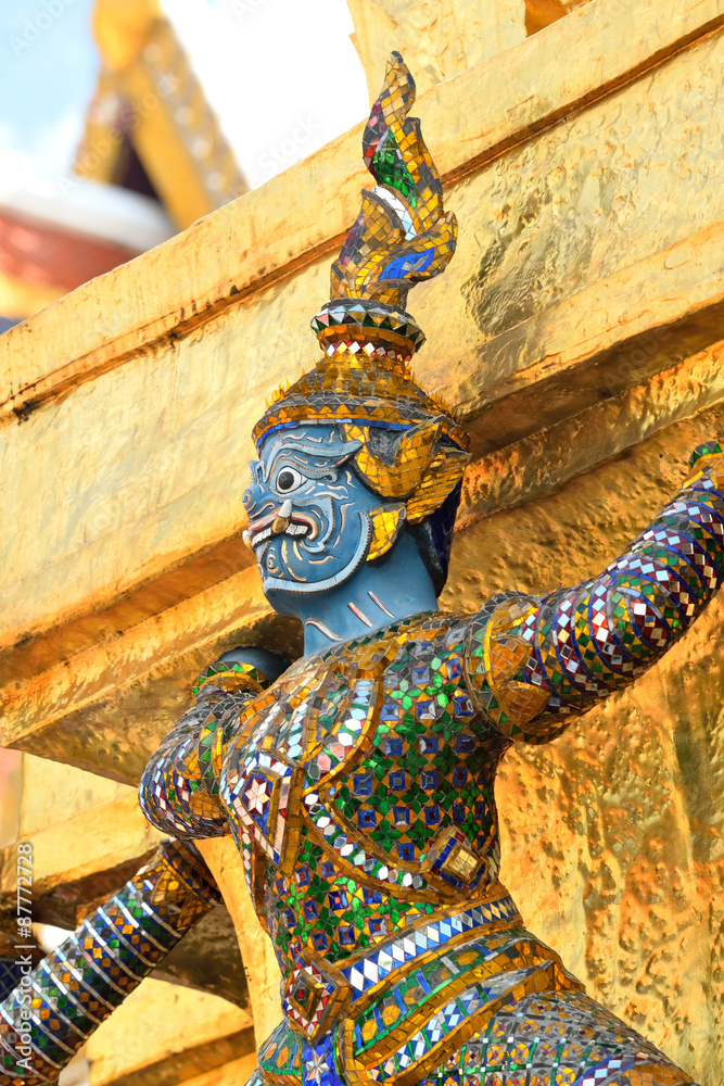The Golden Pagoda and Yak statue at the phra kaew, bangkok,Thailand