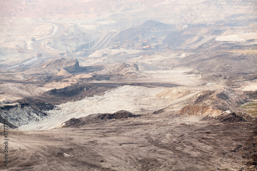 Part of a pit with big mining truck working