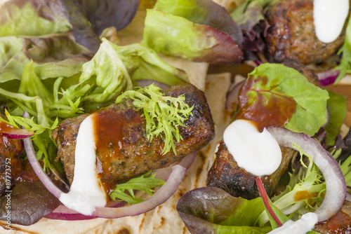 Lamb Kebabs in Flatbread - Minted minced lamb kebabs in flatbreads with salad and sauces. 
