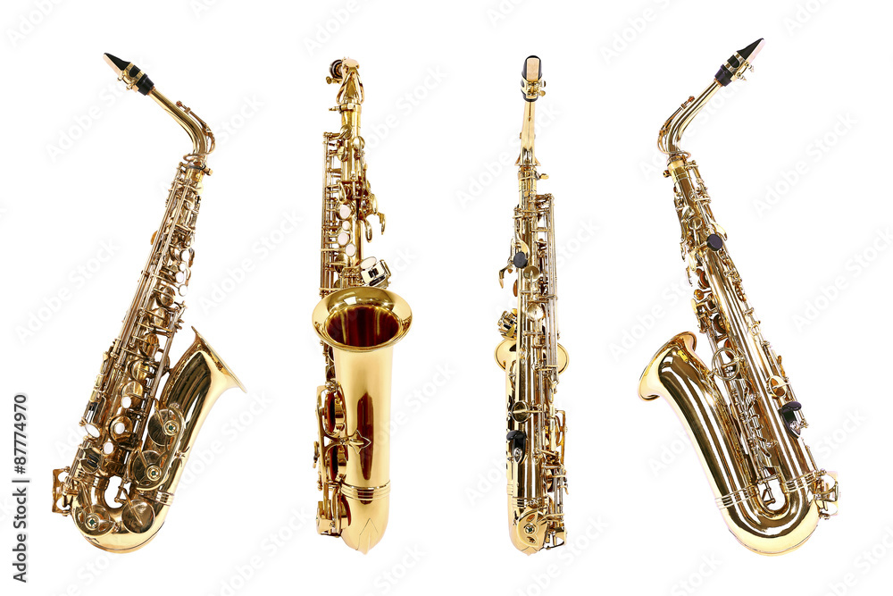 Naklejka premium Golden saxophones isolated on white