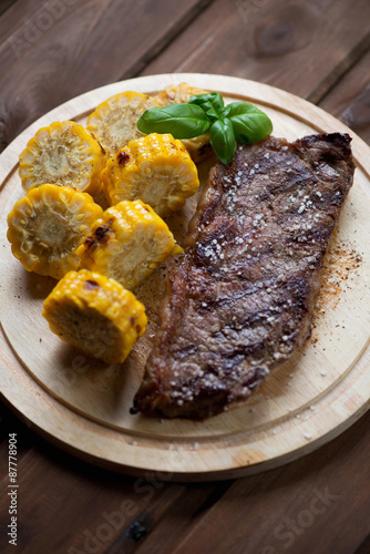 Grilled black angus steak striploin served with sweet corn