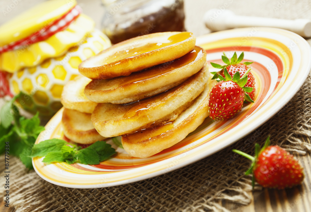 Homemade pancake with honey and strawberry Homemade pancake with honey and strawberry