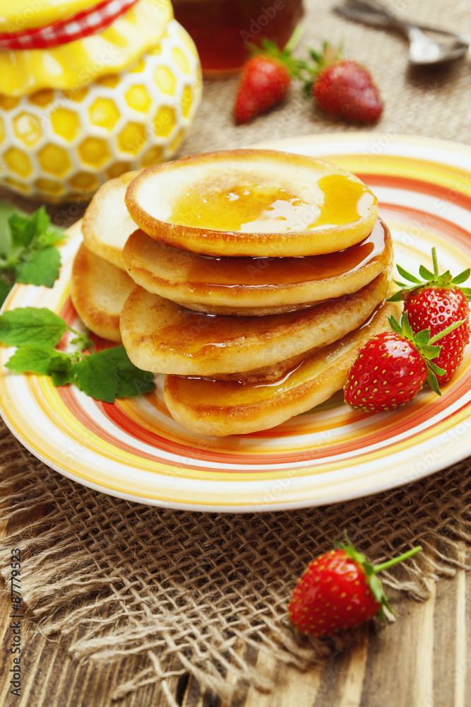 Homemade pancake with honey and strawberry Homemade pancake with honey and strawberry