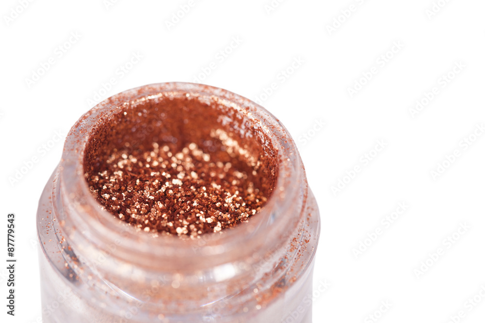 Opened jar with brown bronze shine eye shadows isolated over Opened jar with brown bronze shine eye shadows isolated over