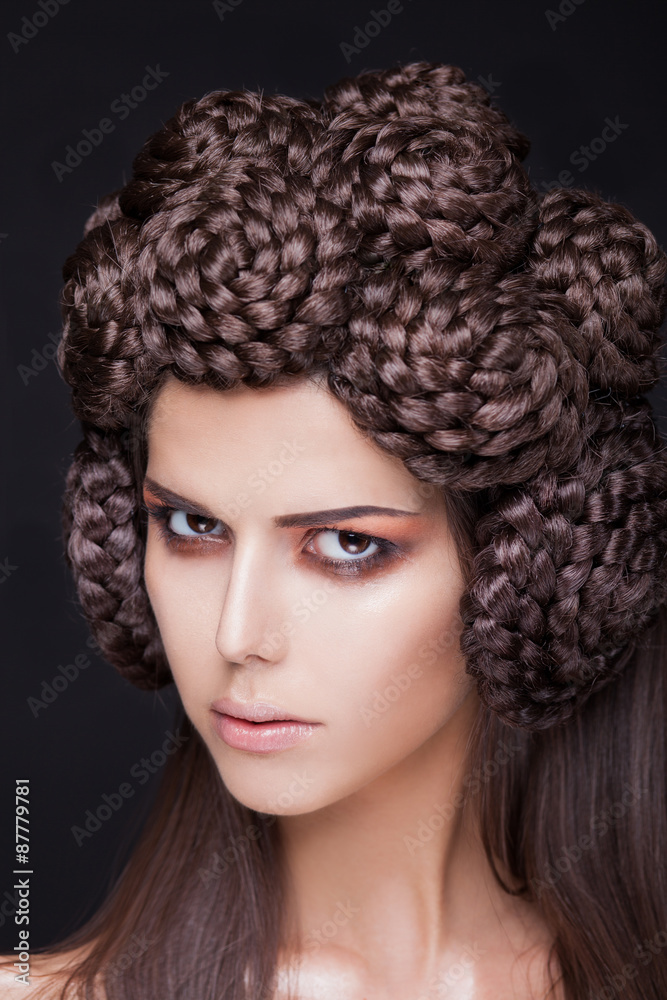 beautiful fashion model with a creative pigtails hairstyling. 
