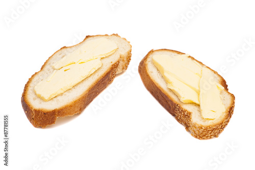 two slices of wheaten bread spreaded with butter