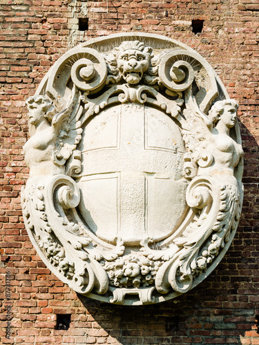 coat-of-arms of milan, sculpture from renaissaince. symbol of the townhall photo